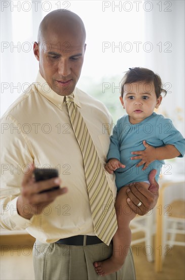 Father with small girl (12-18 months).