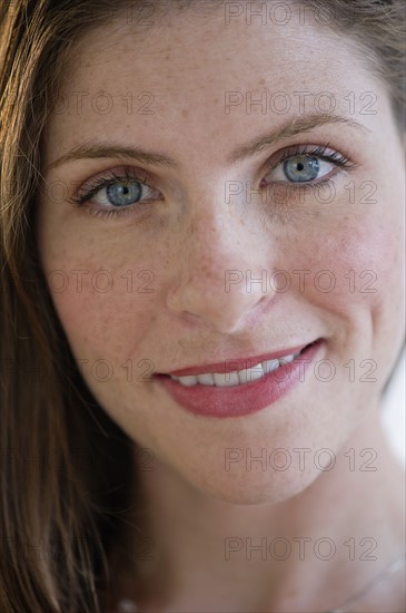 Portrait of smiling young woman.