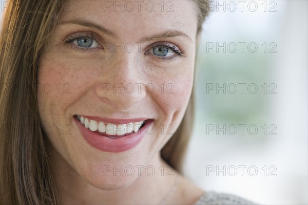 Portrait of smiling young woman.