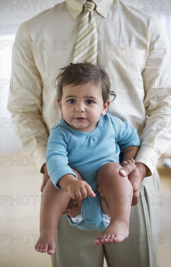 Father with small girl (12-18 months).