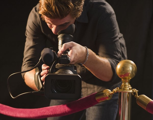 Cameraman at red carpet event. Photo : Jamie Grill