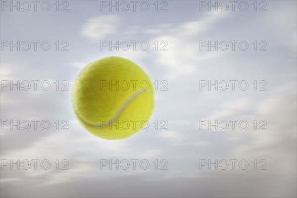 Tennis ball against sky. Photo : Mike Kemp