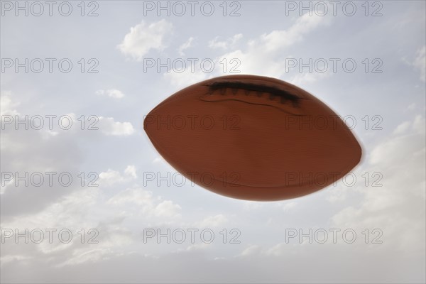 USA, Utah, Lehi, Football against sky. Photo : Mike Kemp