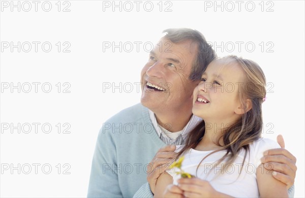 Happy grandfather and granddaughter (10-11). Photo : Momentimages