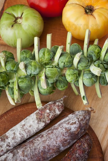 Tomatoes, sausage and brussel sprouts.