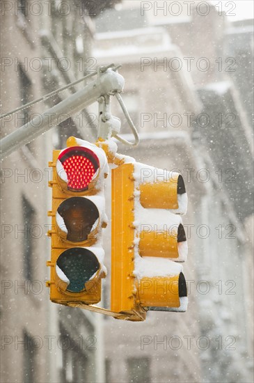 USA, New York, New York City, Snow covered traffic lights.