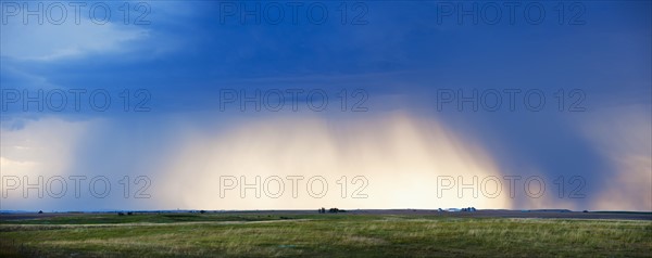 Cloudscape over field.