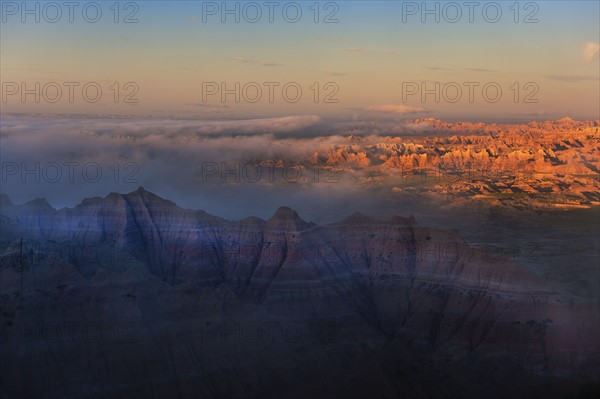 USA, South Dakota, Mountains in Badlands National Park at sunset.