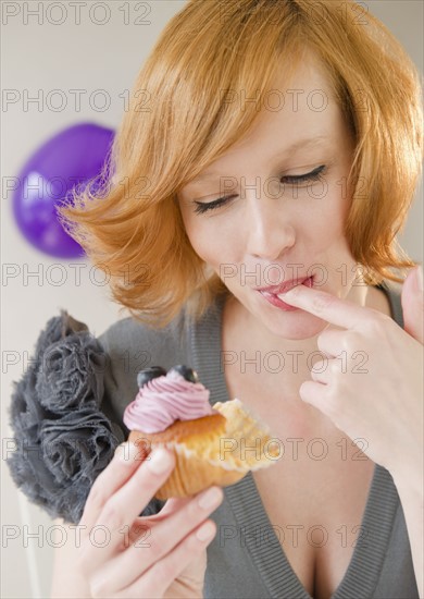 Young woman eating dessert. Photo : Jamie Grill
