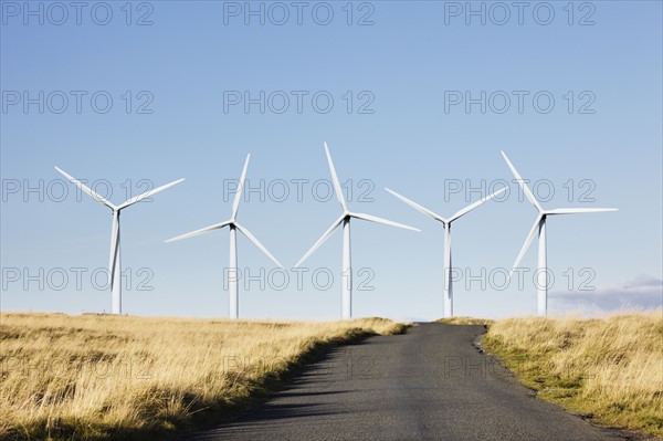 Road leading to wind turbines. Photo : Jon Boyes