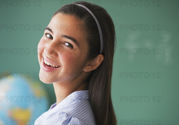 Portrait of girl (12-13) in class.