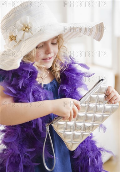 Portrait of blond girl (4-5) in elegant costume. Photo : Jamie Grill