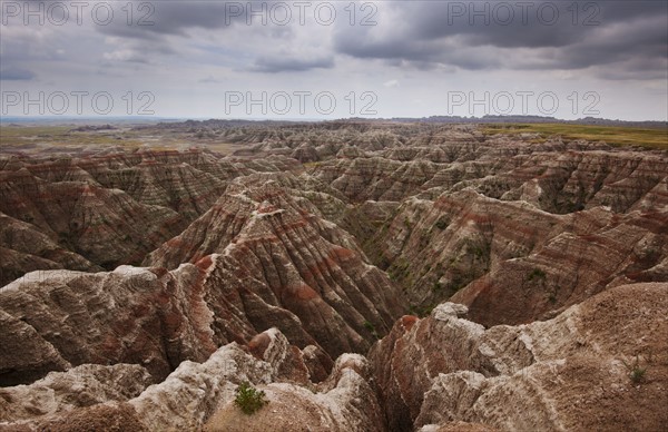 USA, South Dakota, Thick gray clouds over mountains in Badlands National Park.