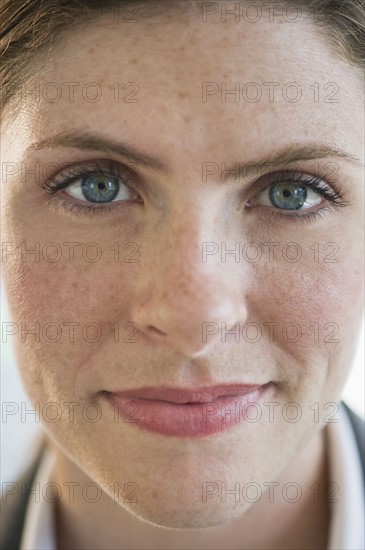 Portrait of woman with freckles.