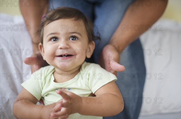 Father with small girl (12-18 months).