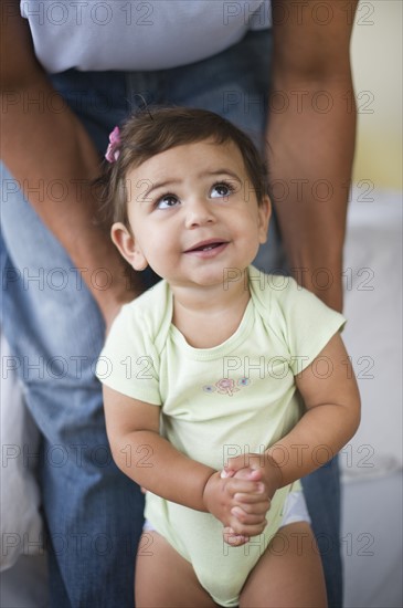 Father with small girl (12-18 months).