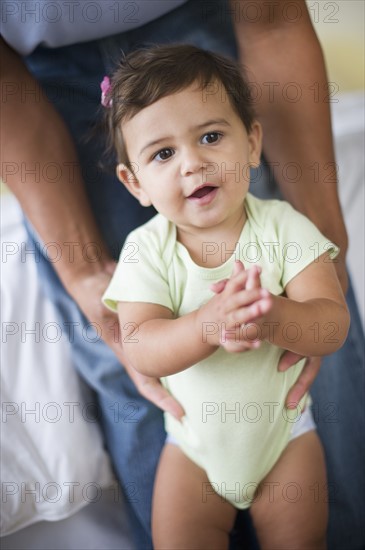 Father with small girl (12-18 months).