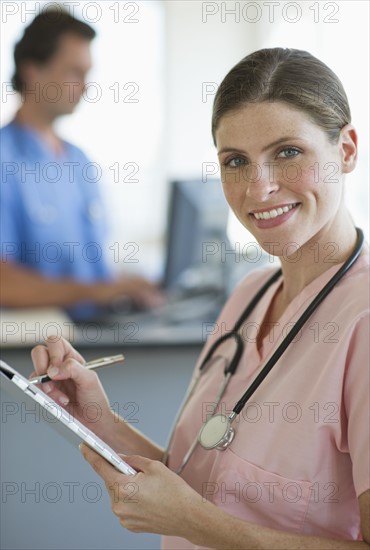 Smiling female doctor in hospital.