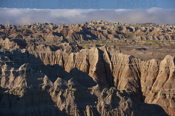 USA, South Dakota, Mountains in morning fog in Badlands National Park.