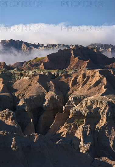 USA, South Dakota, Mountains in morning fog in Badlands National Park.