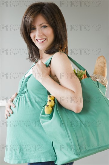 Young pregnant woman. Photo : Jamie Grill