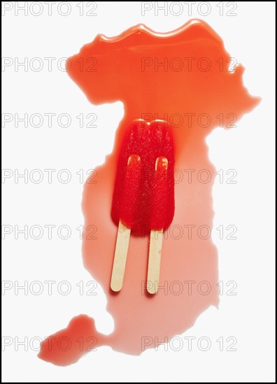 Melting red ice lollies. Photo : Mike Kemp