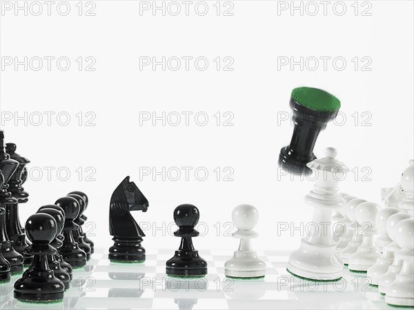 Black and white chess teams with taken rook. Photo : David Arky