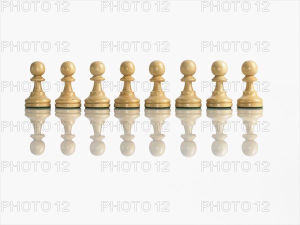 Row of pawn chess pieces. Photo : David Arky