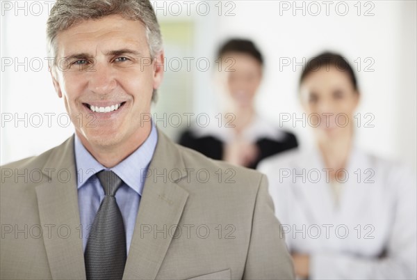 Portrait of cheerful businessman. Photo : Momentimages