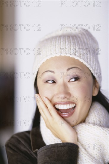 Pretty woman wearing winter hat and scarf. Photo : Fisher Litwin