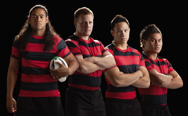 Studio portrait of male rugby team. Photo : Mike Kemp