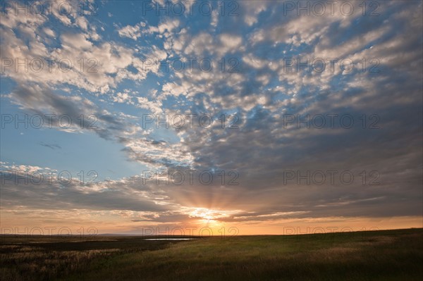 Sunset above prairie.