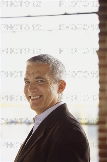 Handsome man wearing suit. Photo : Fisher Litwin