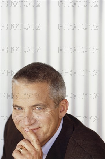 Handsome man wearing suit. Photo : Fisher Litwin