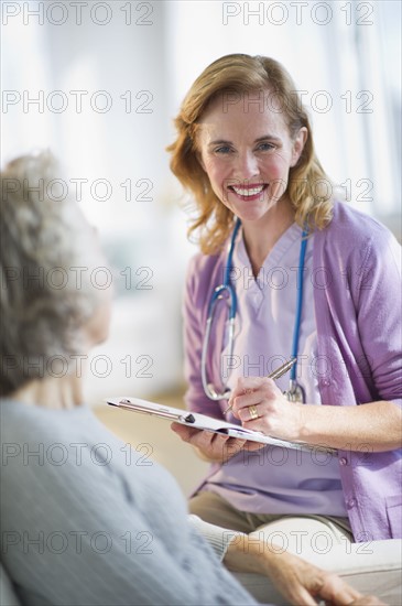 USA, New Jersey, Jersey City, Female nurse with patient.