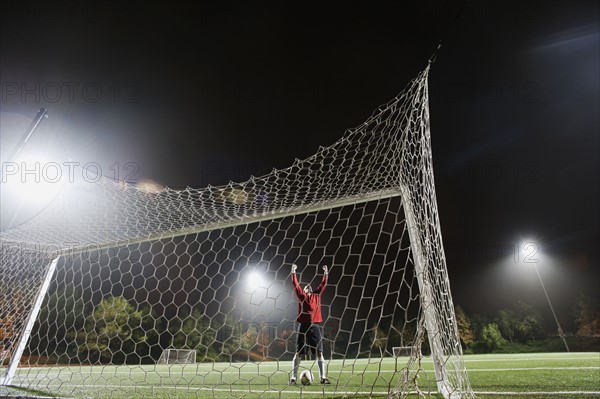 USA, California, Ladera Ranch, Football player preparing for penalty kick.