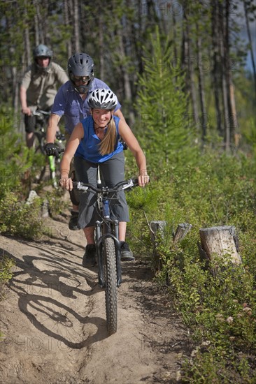 Canada, British Columbia, Fernie, Group of three people enjoying mountain biking. Photo : Dan Bannister