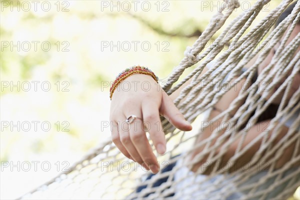 USA, Utah, close up of woman's hand on hammock. Photo : Tim Pannell