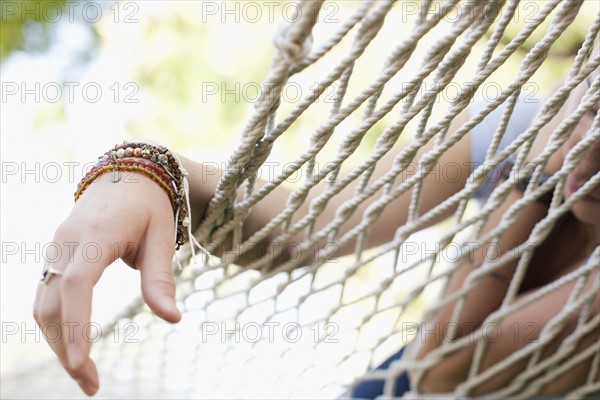 USA, Utah, close up of woman's hand on hammock. Photo : Tim Pannell