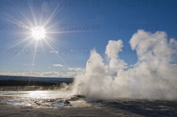 USA, Wyoming, Sun over steaming thermal pool. Photo : Gary J Weathers