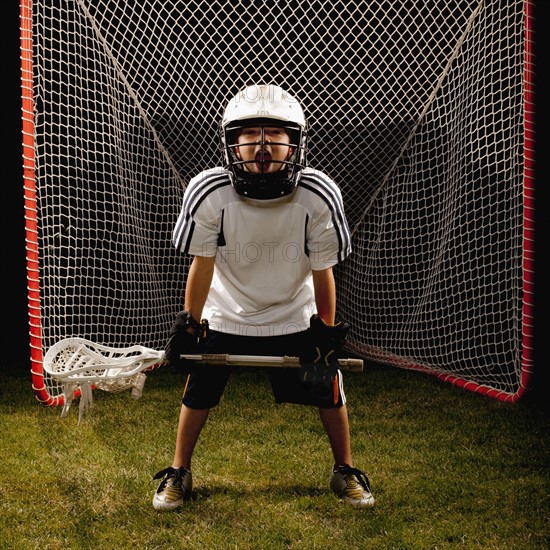 USA, Utah, Provo, Junior (6-7) lacrosse player in goal. Photo : FBP