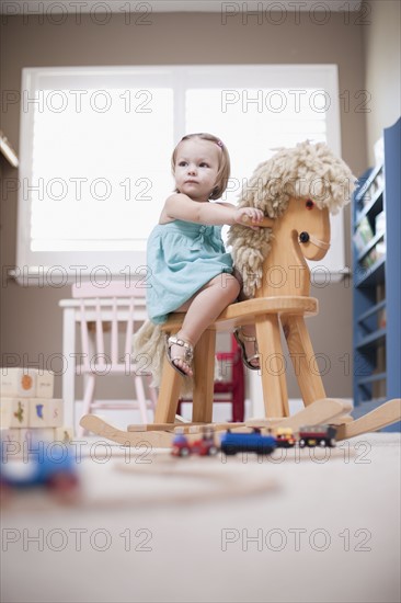 USA, Utah, small girl (2-3) on rocking horse. Photo : Tim Pannell