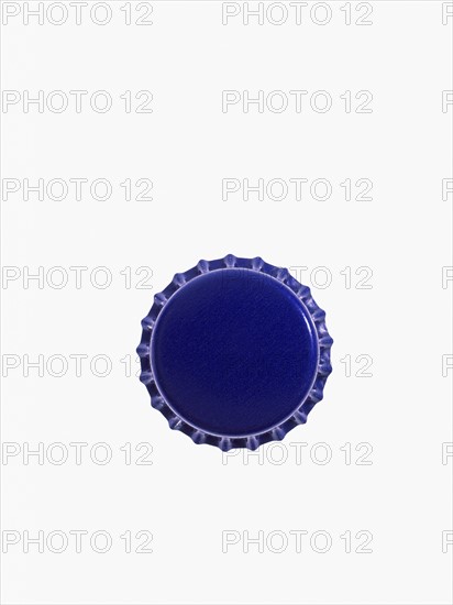 Studio shot of blue bottle cap. Photo : David Arky