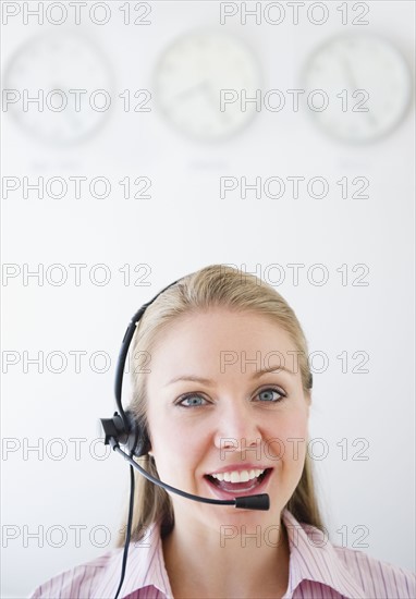 USA, New Jersey, Jersey City, Portrait of young female call centre agent. Photo : Jamie Grill Photography