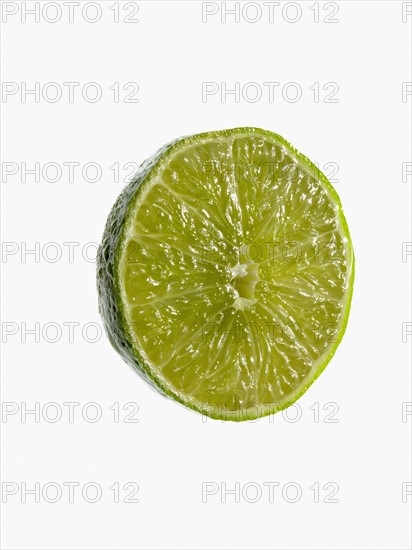 Studio shot of cross section of lime. Photo : David Arky