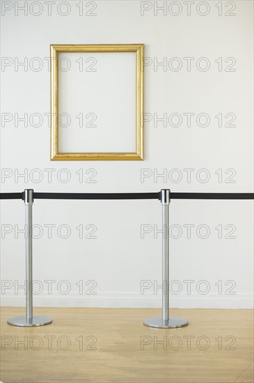 Blank picture frame in empty art gallery.