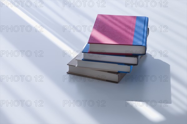 Sunlight on stacked books.