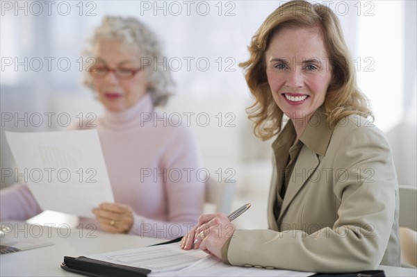 USA, New Jersey, Jersey City, Portrait of financial advisor with senior woman in home.