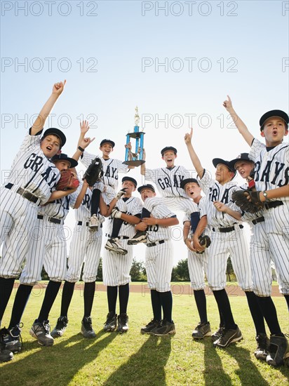 USA, California, Ladera Ranch, little league players (aged 10-11) celebrating.