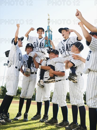 USA, California, Ladera Ranch, little league players (aged 10-11) celebrating.